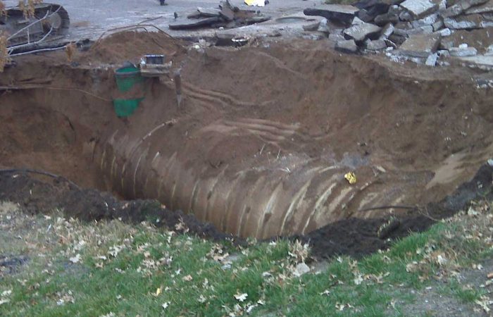 Underground tank being buried in dirt